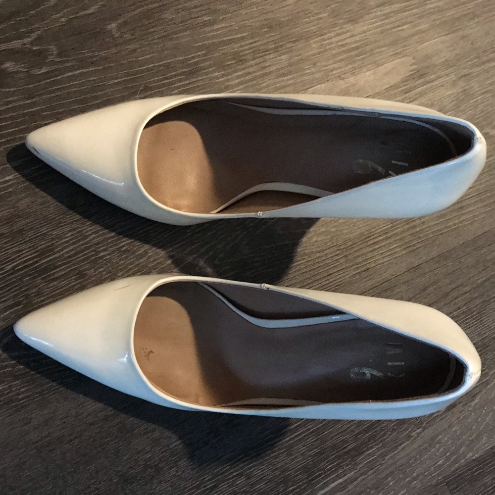 White patent pumps